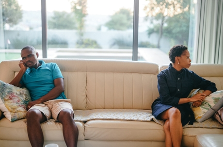 Divorced couple mad on couch