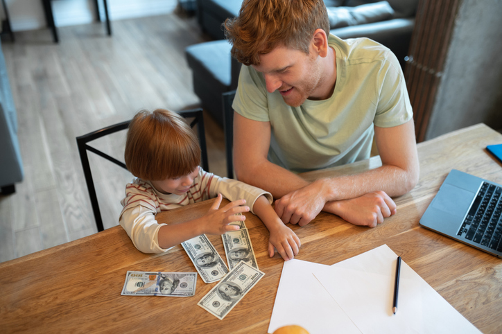 father and son counting money